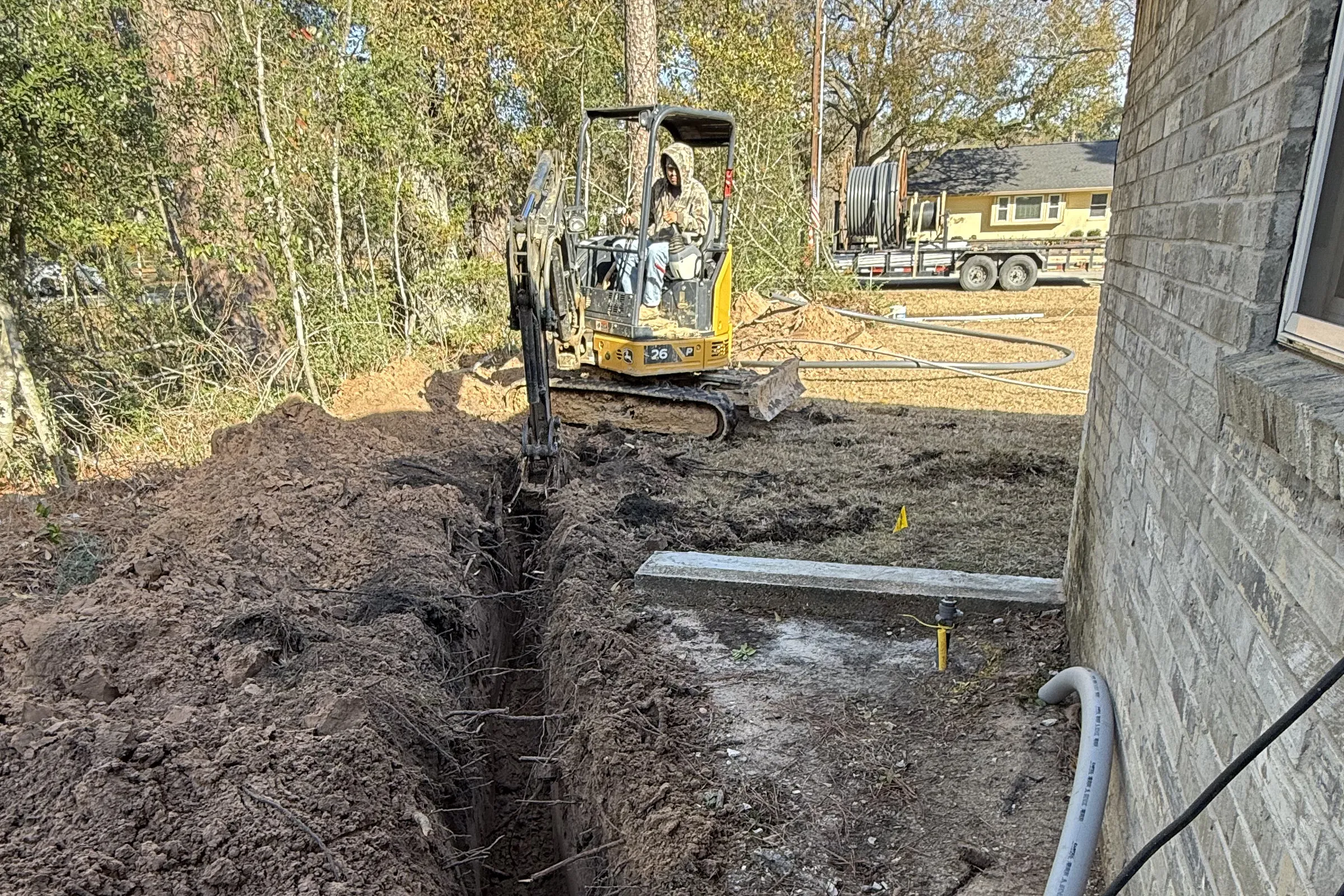 Outdoor working area in backyard to add pipes underground